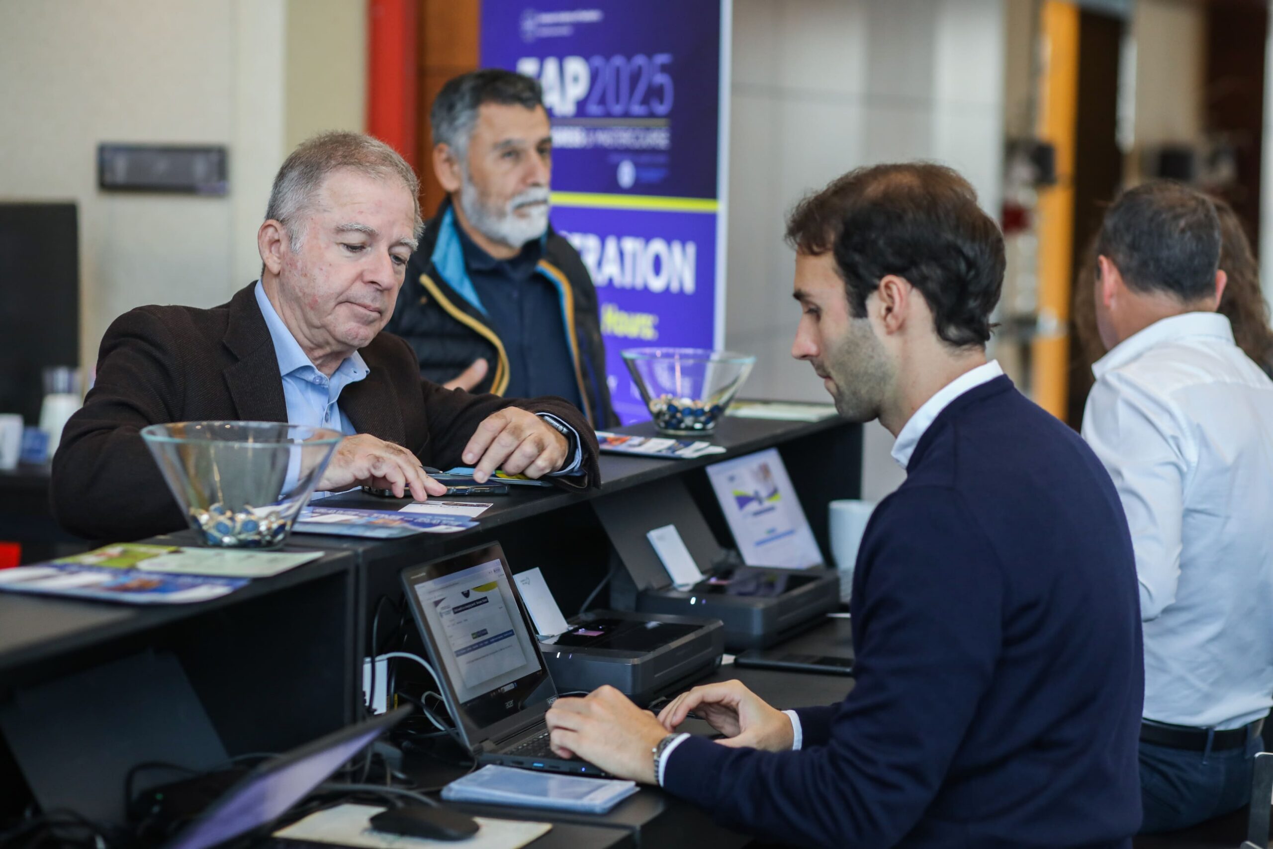 Paragon team members working together at a conference